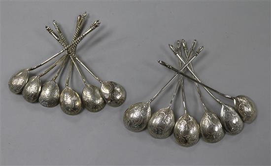A set of six 19th century Russian 84 zolotnik parcel gilt silver teaspoons, 1875 and one other set of six Russian silver teaspoons
